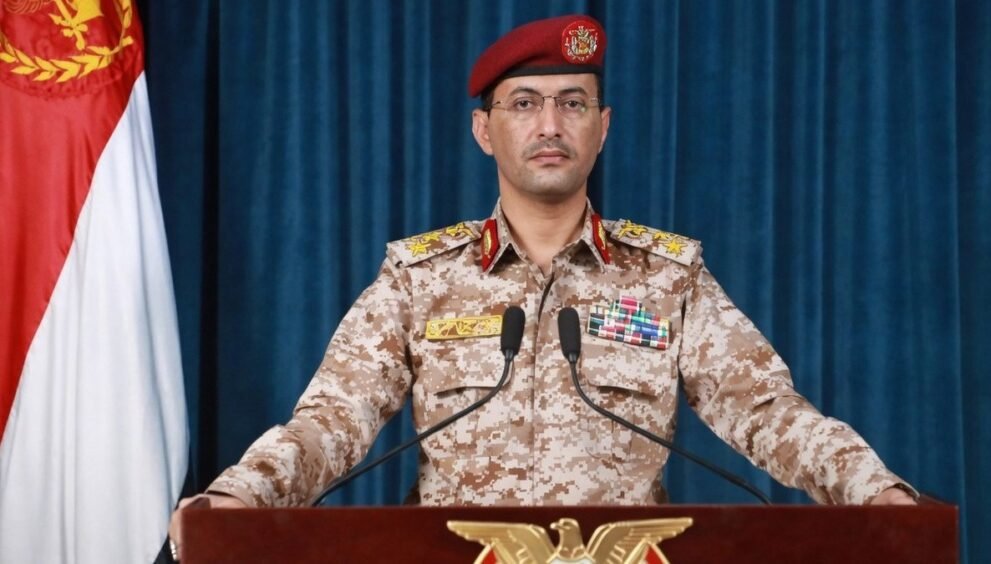Houthi military spokesman Yahya Saree at a briefing podium (file photo)